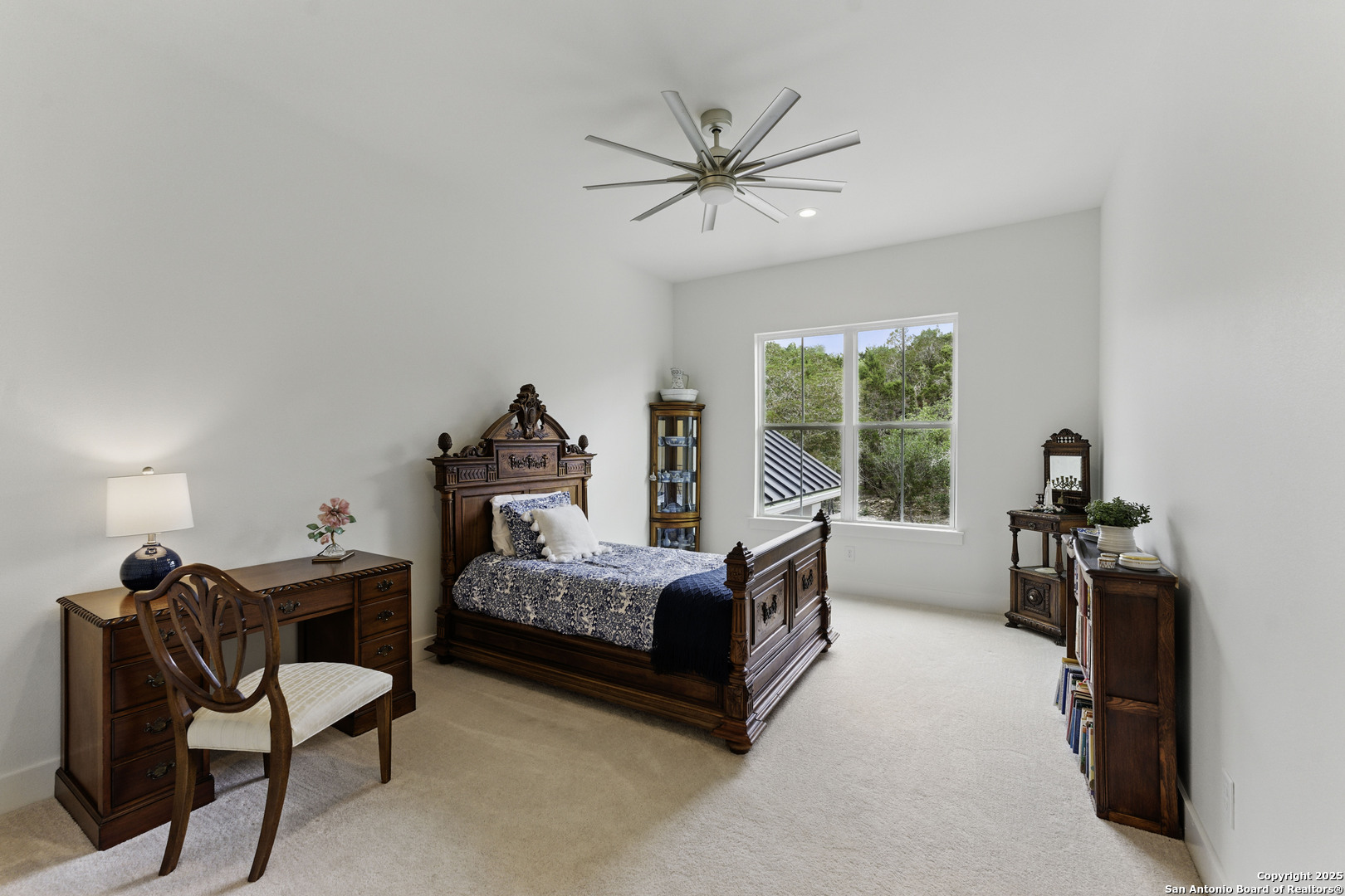 321 Bentwood Drive Spring Branch, TX 78070 - Photo 38 of 50 a bedroom with a bed and a chandelier