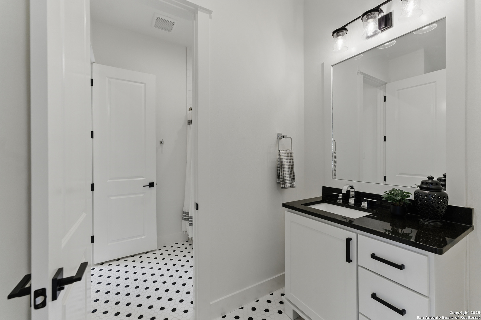 321 Bentwood Drive Spring Branch, TX 78070 - Photo 39 of 50 a bathroom with a sink and a mirror