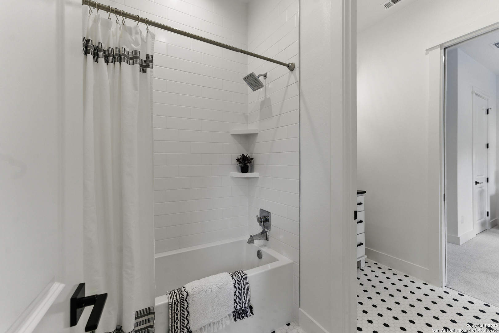 321 Bentwood Drive Spring Branch, TX 78070 - Photo 40 of 50 a bathroom with a bathtub and shower