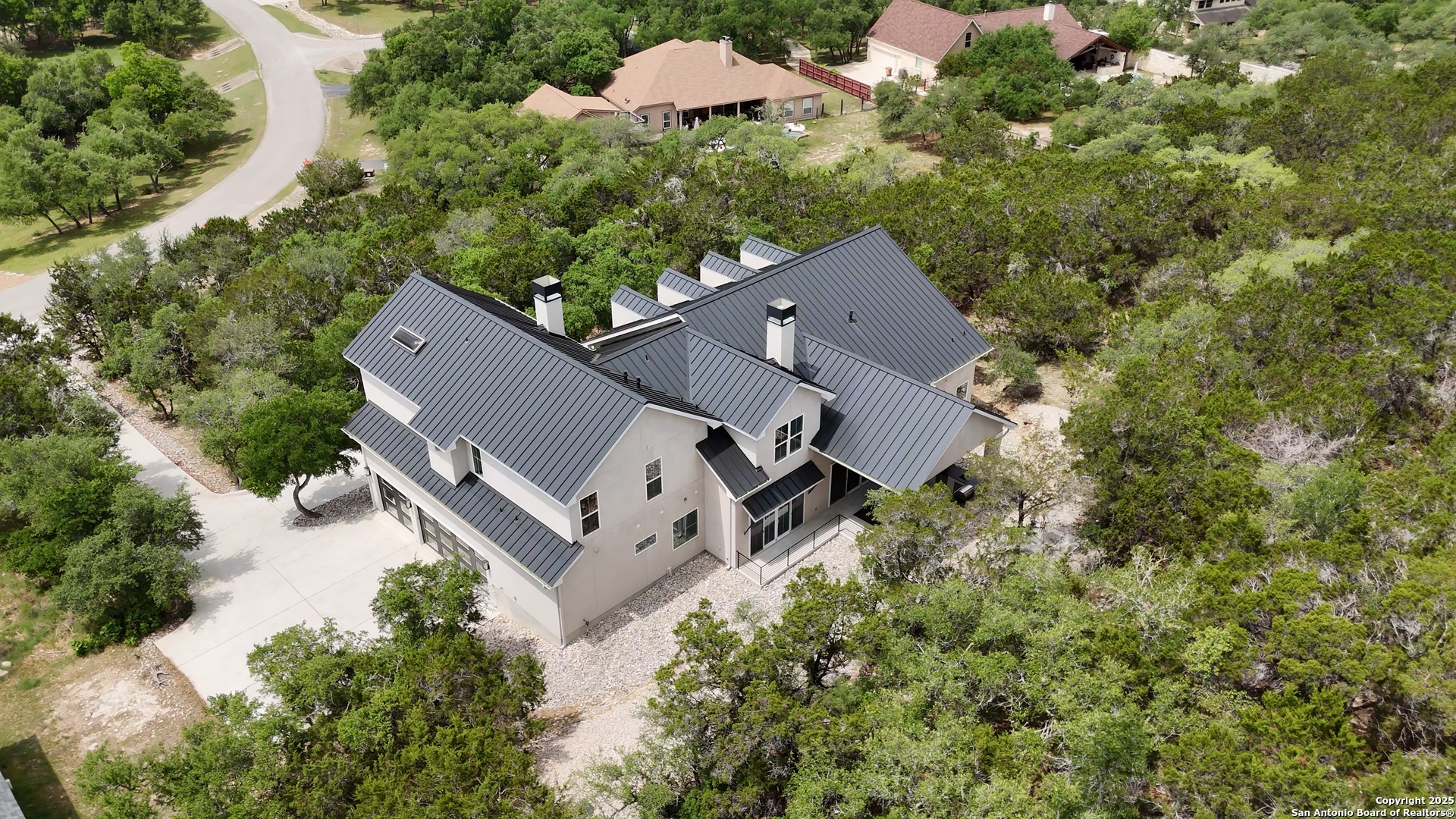 321 Bentwood Drive Spring Branch, TX 78070 - Photo 48 of 50 an aerial view of a house with a yard and trees all around