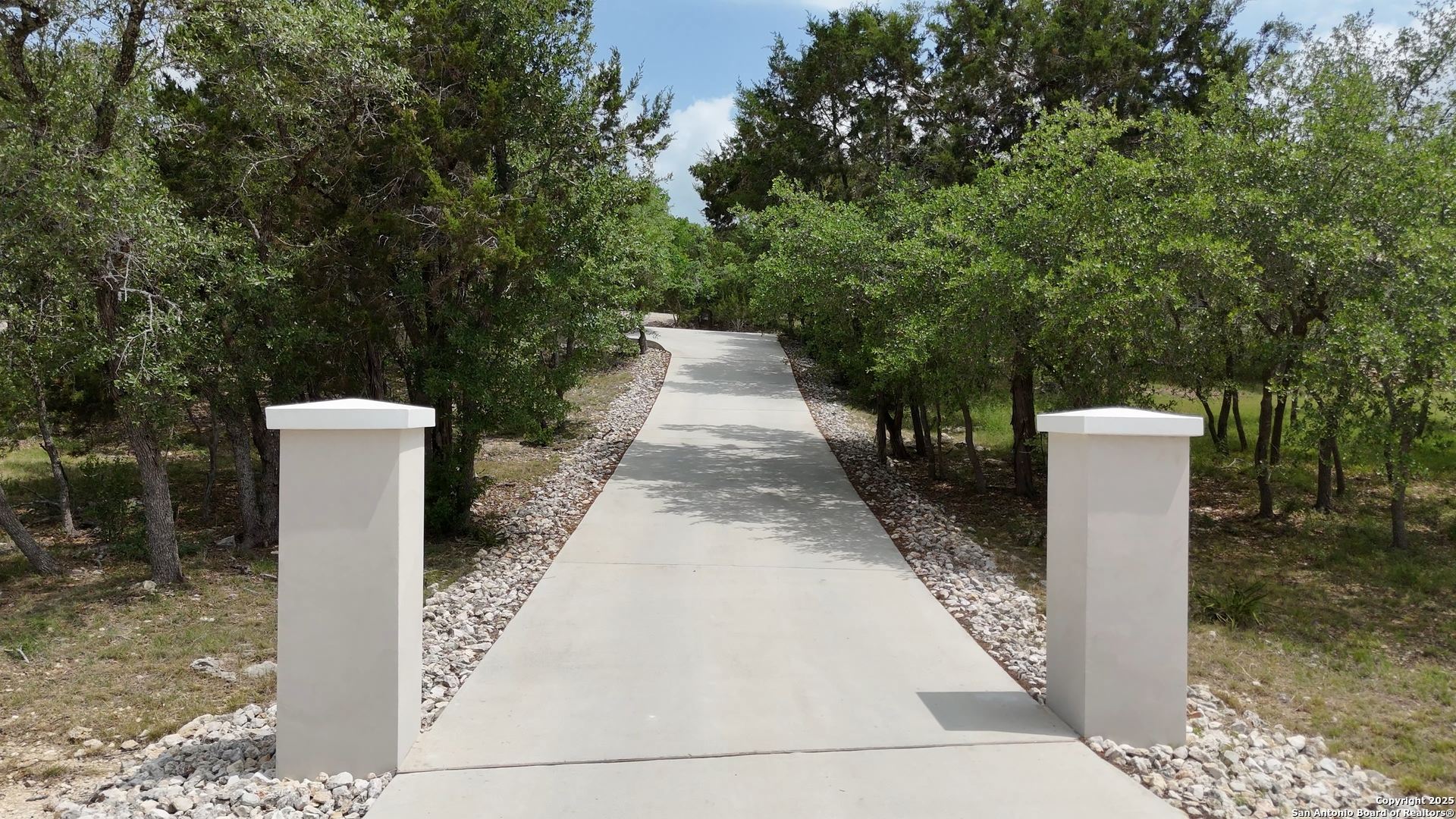 321 Bentwood Drive Spring Branch, TX 78070 - Photo 5 of 50 a view of a pathway with a fountain