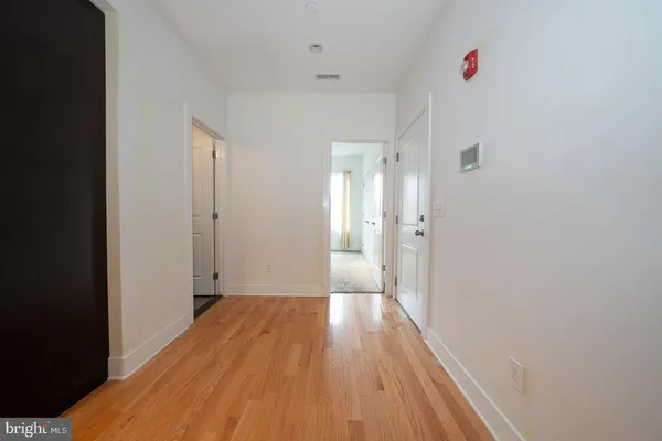 a view of an empty room with a window