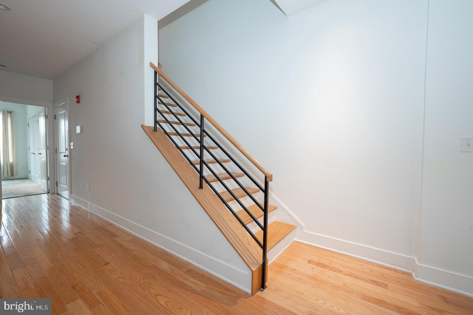 110 Naudain Street, Unit 4 Philadelphia, PA 19147 - Photo 16 of 45 a view of an entryway with wooden floor