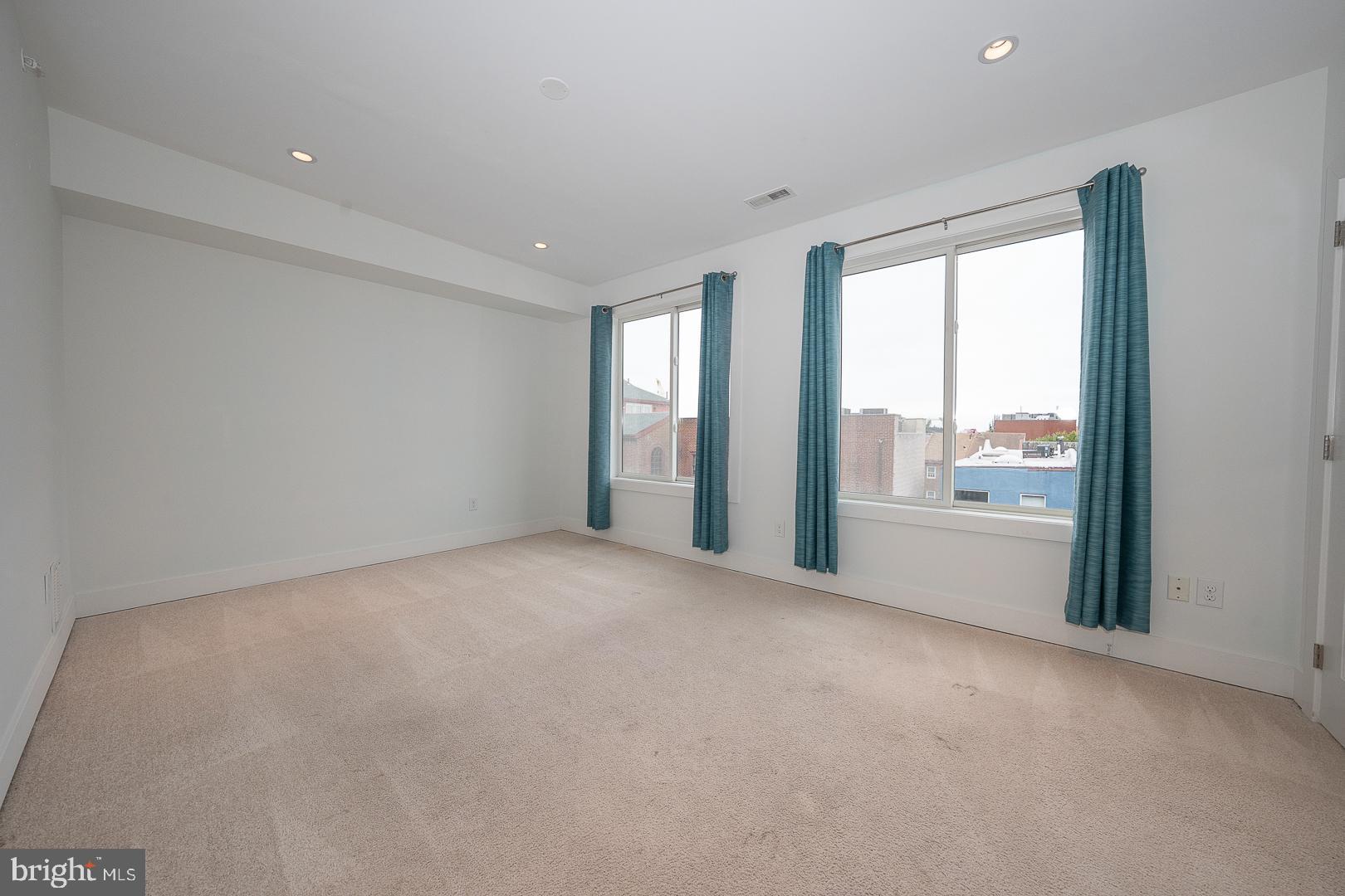 110 Naudain Street, Unit 4 Philadelphia, PA 19147 - Photo 18 of 45 a view of an empty room with a window