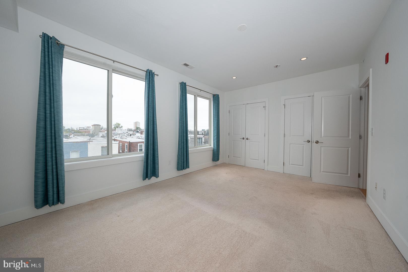110 Naudain Street, Unit 4 Philadelphia, PA 19147 - Photo 19 of 45 a view of an empty room with a window
