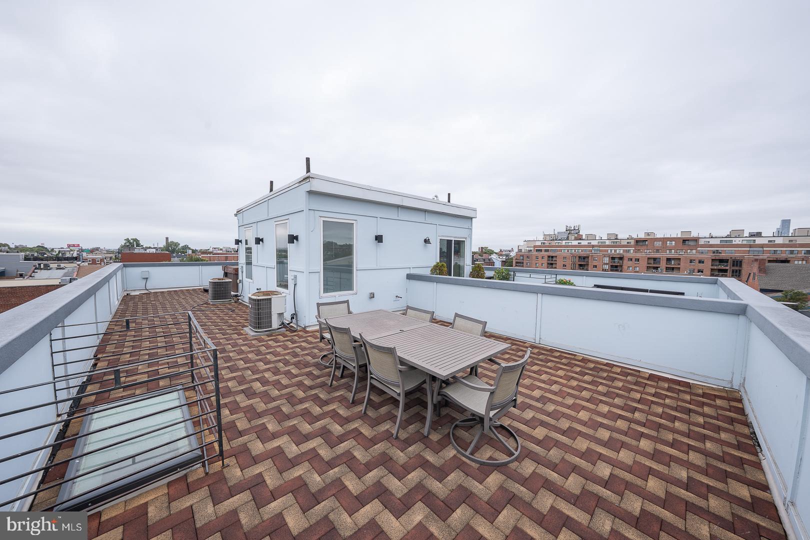 110 Naudain Street, Unit 4 Philadelphia, PA 19147 - Photo 39 of 45 a roof deck view with barbeque oven and sitting space