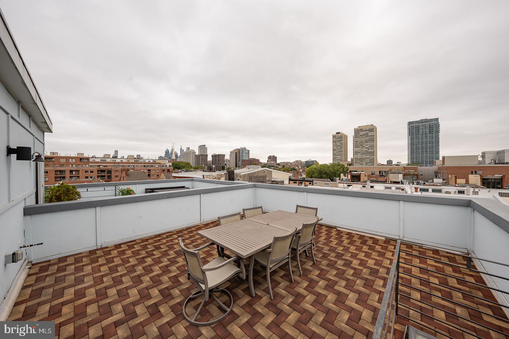 110 Naudain Street, Unit 4 Philadelphia, PA 19147 - Photo 40 of 45 a terrace with outdoor seating city view and barbeque oven