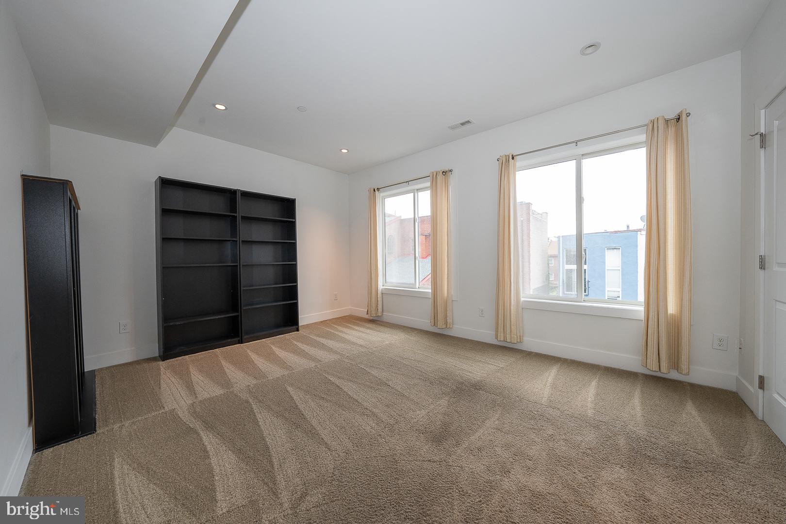 110 Naudain Street, Unit 4 Philadelphia, PA 19147 - Photo 7 of 45 a view of an empty room with a window and closet