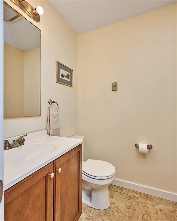 44 Evergreen Road, Unit 302 Northampton, MA 01053 - Photo 12 of 22 a bathroom with a sink a toilet and vanity