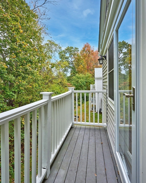 44 Evergreen Road, Unit 302 Northampton, MA 01053 - Photo 16 of 22 a view of a balcony with wooden floor