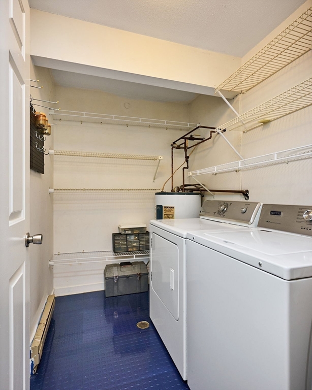 44 Evergreen Road, Unit 302 Northampton, MA 01053 - Photo 17 of 22 a view of storage and utility room with washer and dryer