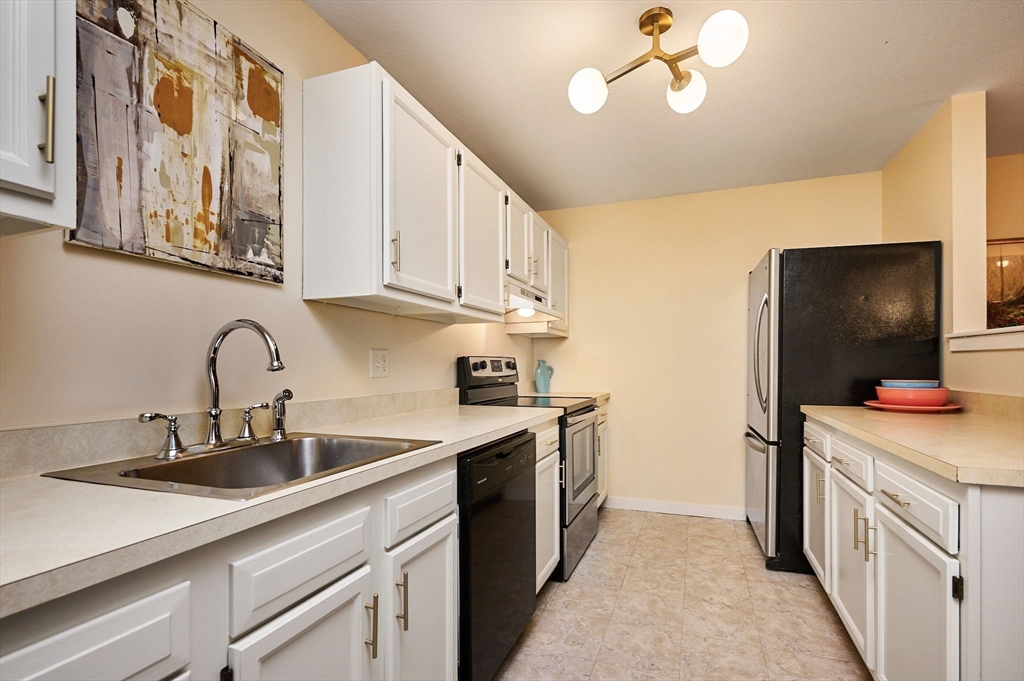 44 Evergreen Road, Unit 302 Northampton, MA 01053 - Photo 7 of 22 a kitchen with a sink and cabinets