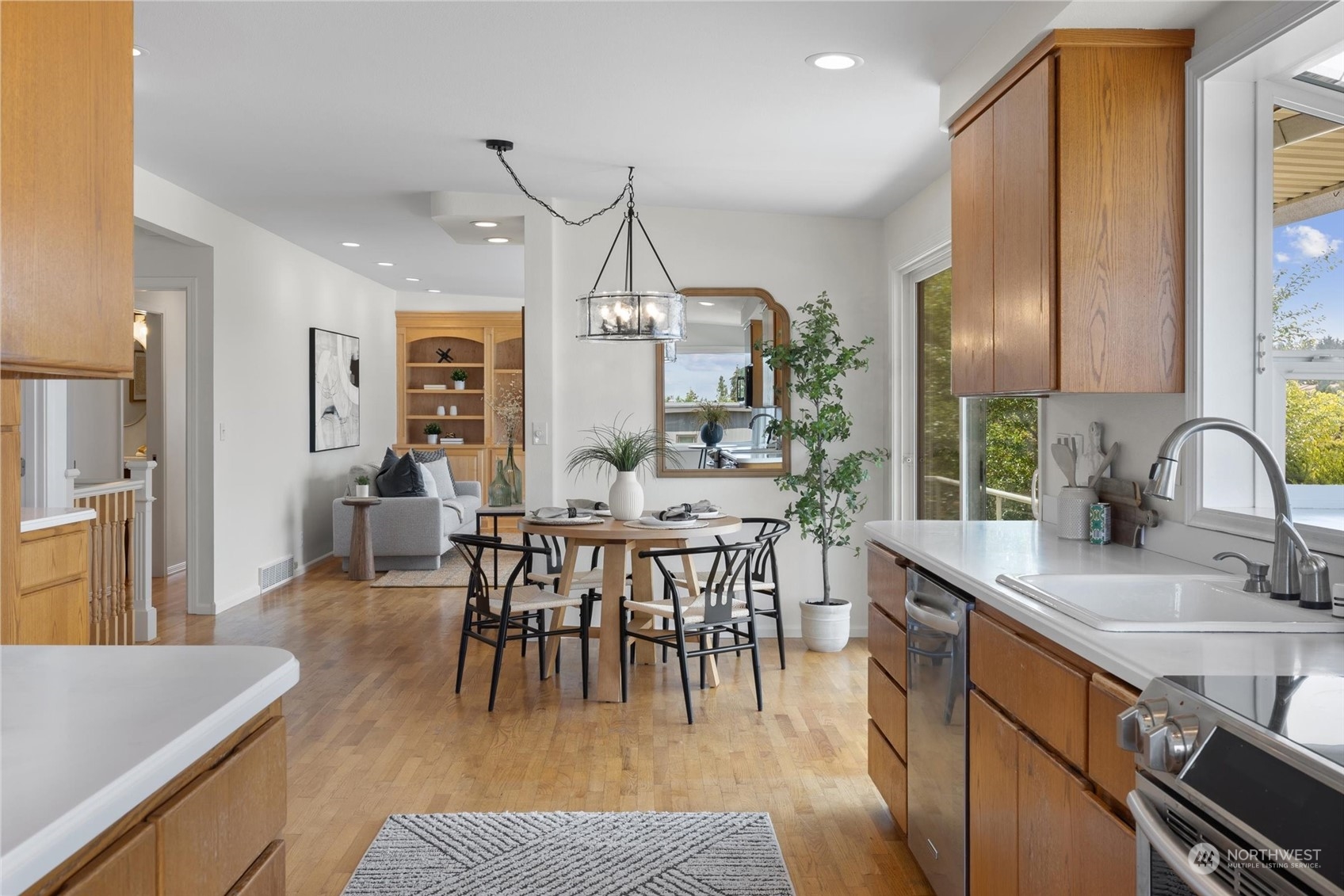 730 Laurel Street Edmonds, WA 98020 - Photo 11 of 36 a view of a dining room with furniture window and wooden floor
