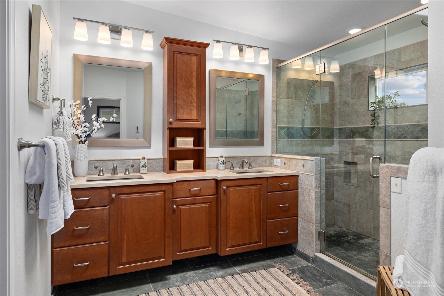 730 Laurel Street Edmonds, WA 98020 - Photo 19 of 36 a spacious bathroom with a shower sink and mirror