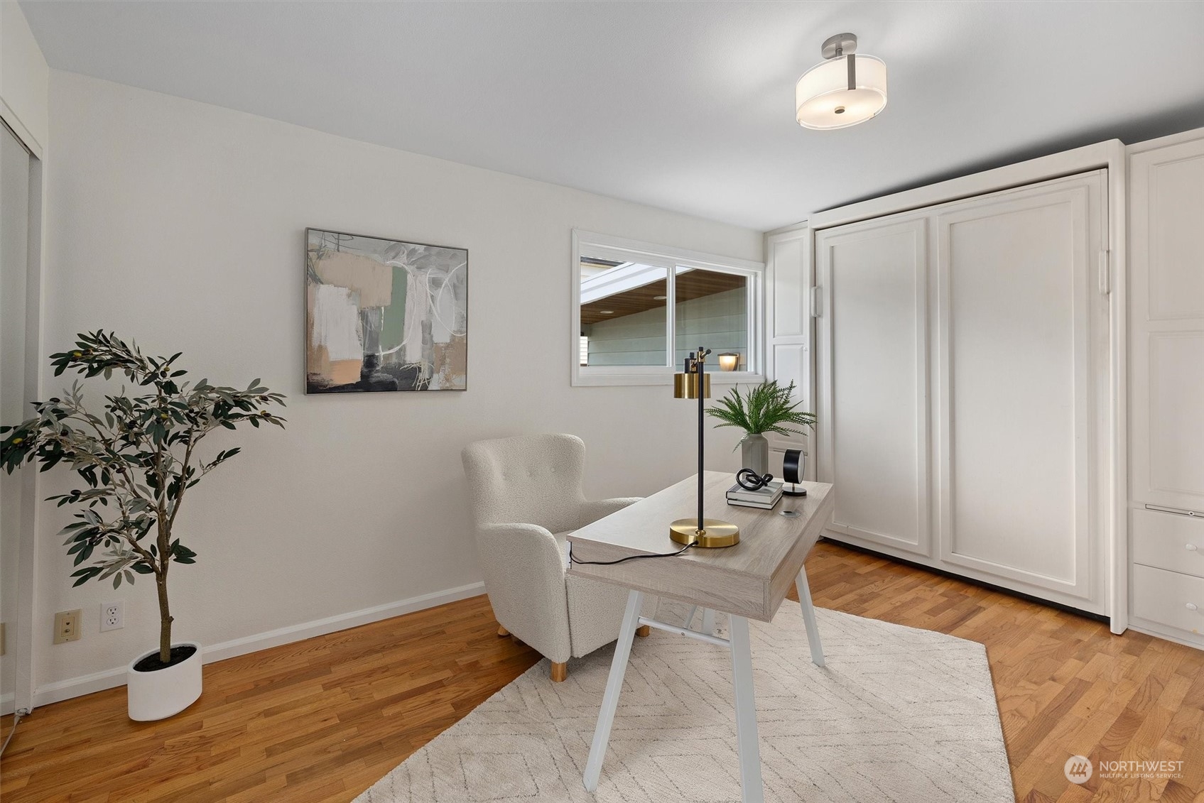 730 Laurel Street Edmonds, WA 98020 - Photo 20 of 36 a workspace with furniture and wooden floor