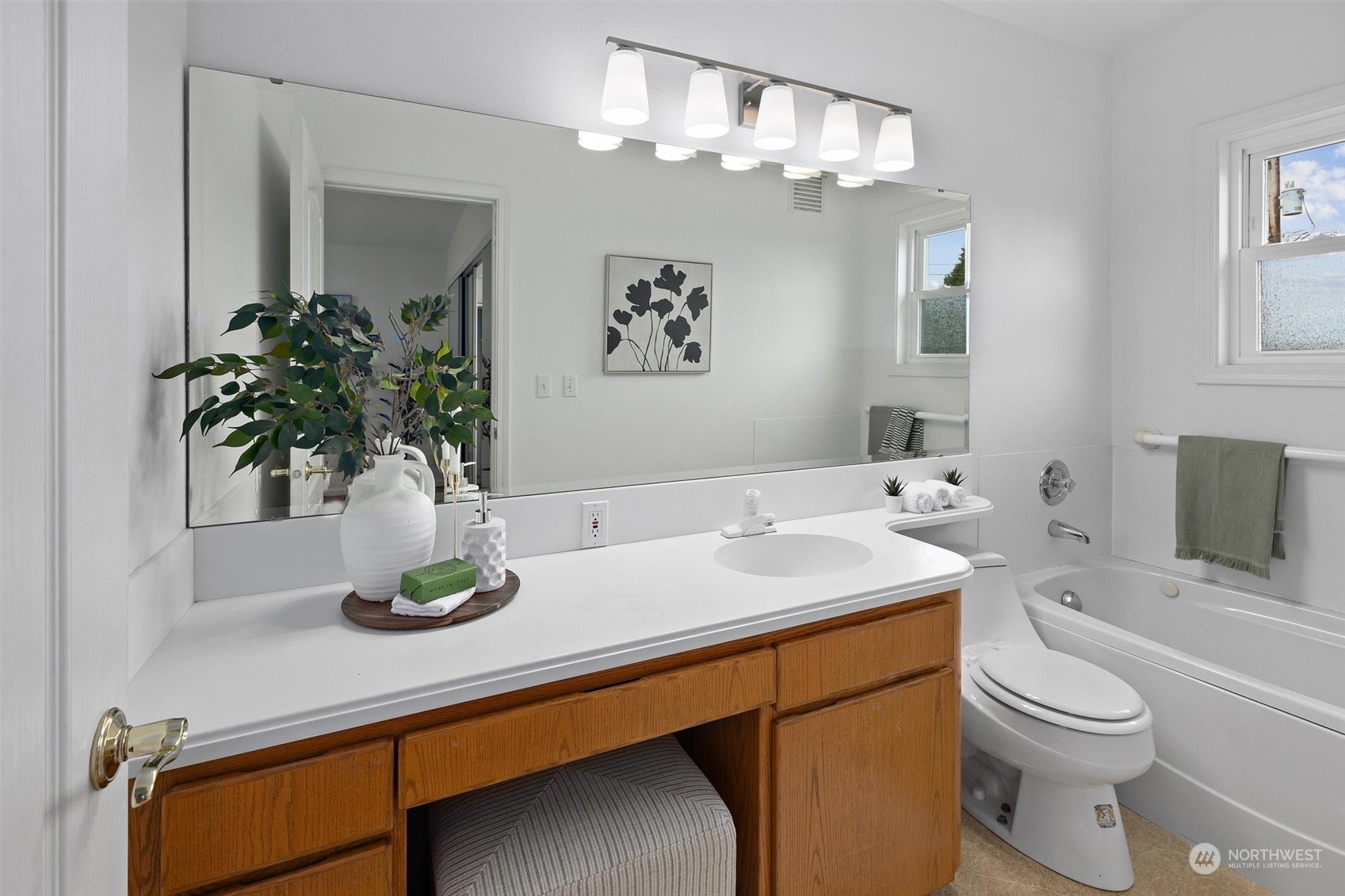 730 Laurel Street Edmonds, WA 98020 - Photo 23 of 36 a bathroom with a granite countertop sink a mirror and vanity