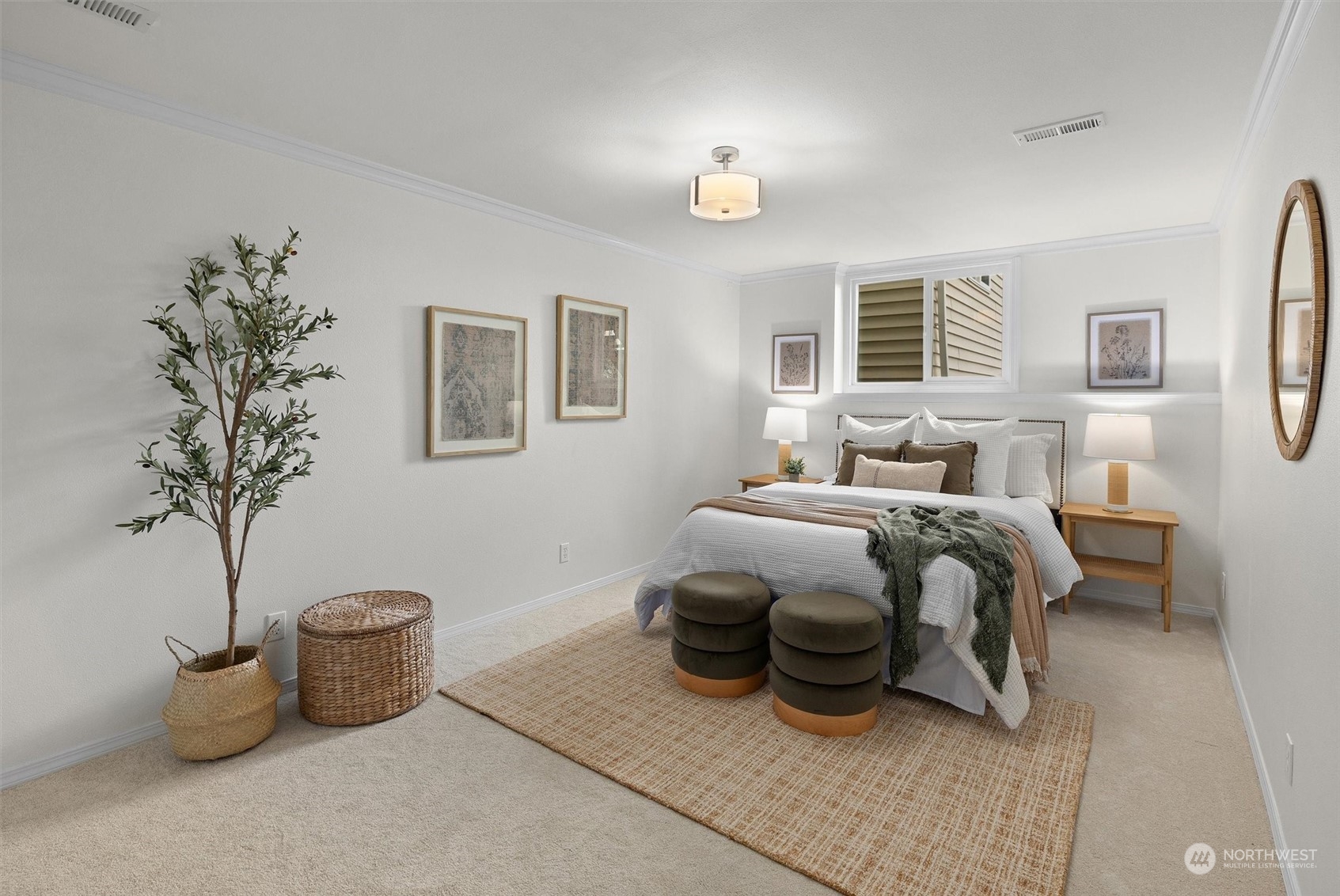 730 Laurel Street Edmonds, WA 98020 - Photo 28 of 36 a bedroom with a bed and a potted plant