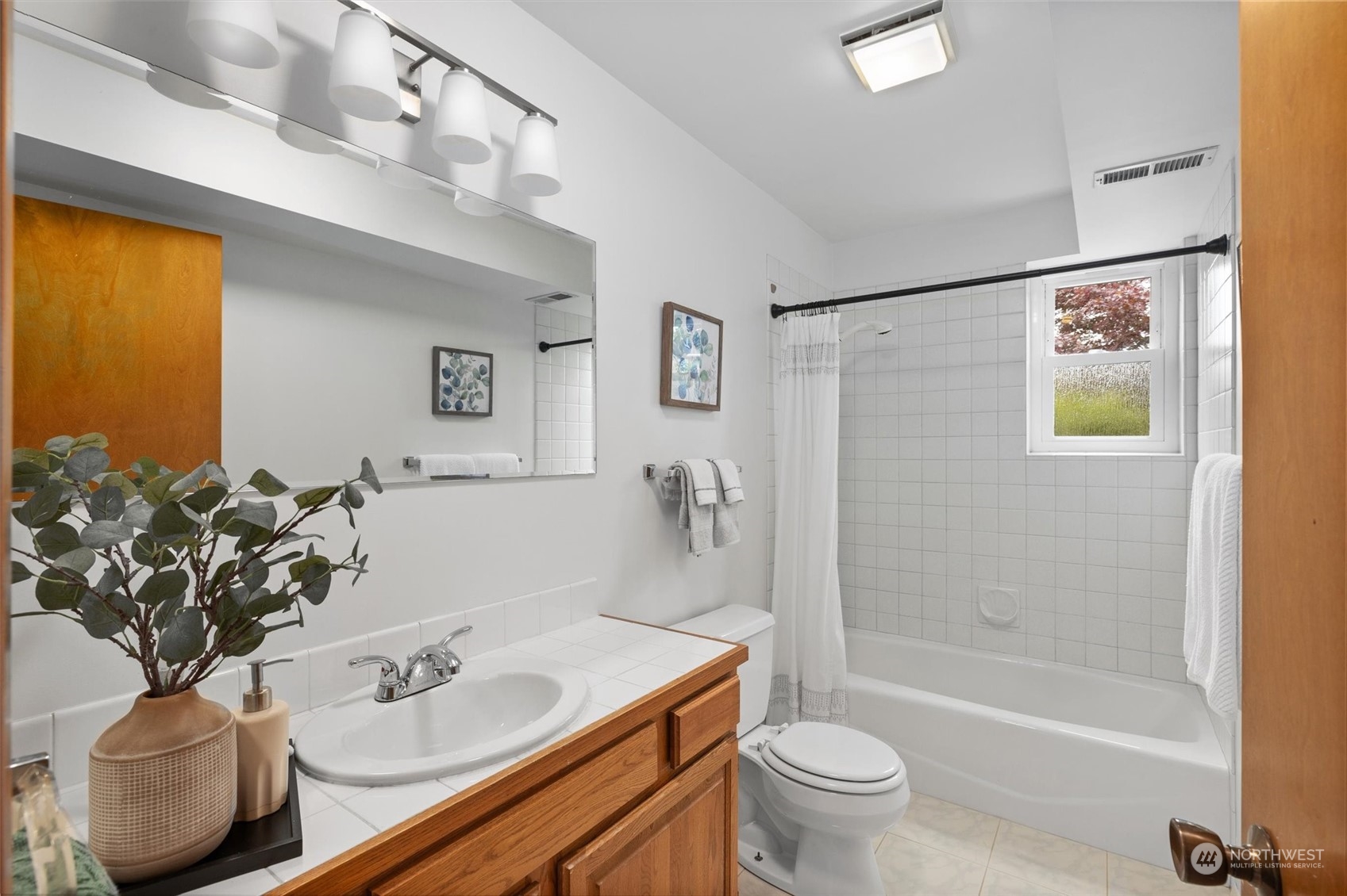 730 Laurel Street Edmonds, WA 98020 - Photo 30 of 36 a bathroom with a sink a toilet and shower