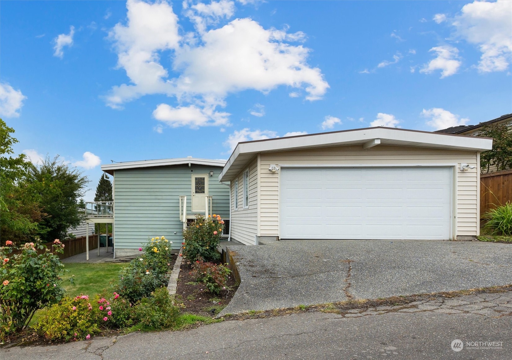 730 Laurel Street Edmonds, WA 98020 - Photo 34 of 36 a front view of a house with a yard and garage