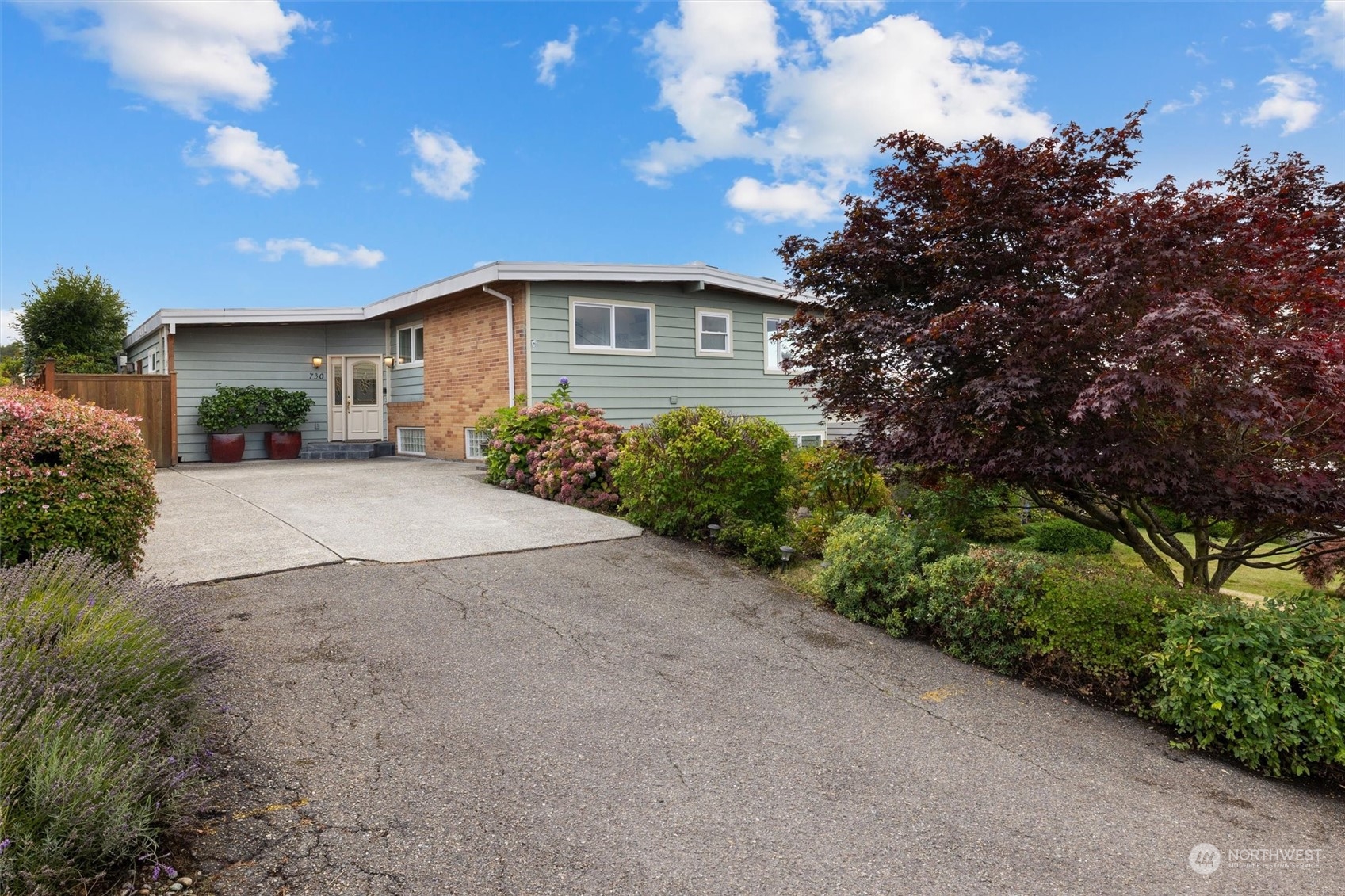 730 Laurel Street Edmonds, WA 98020 - Photo 36 of 36 a front view of a house with a yard and garage