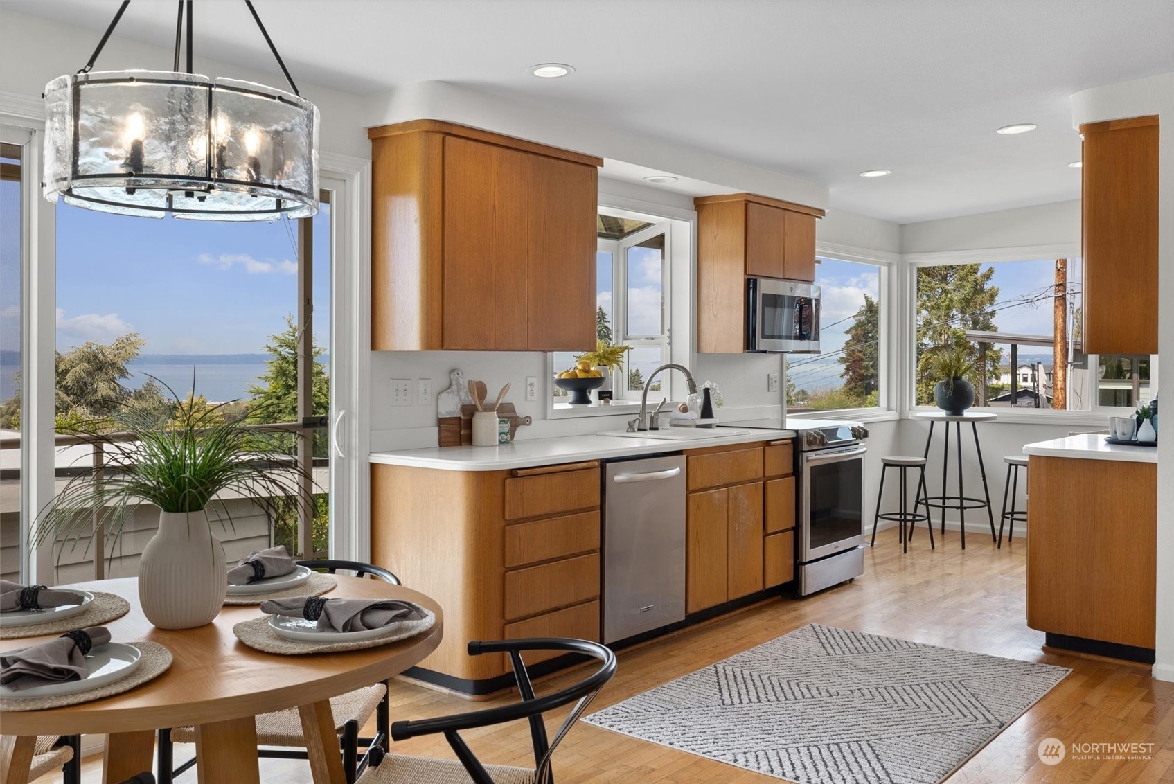 730 Laurel Street Edmonds, WA 98020 - Photo 7 of 36 a kitchen with sink dining table and chairs