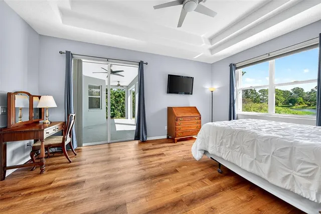 a view of a lake with table and chairs