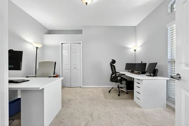 a view of a patio with table and chairs and potted plants