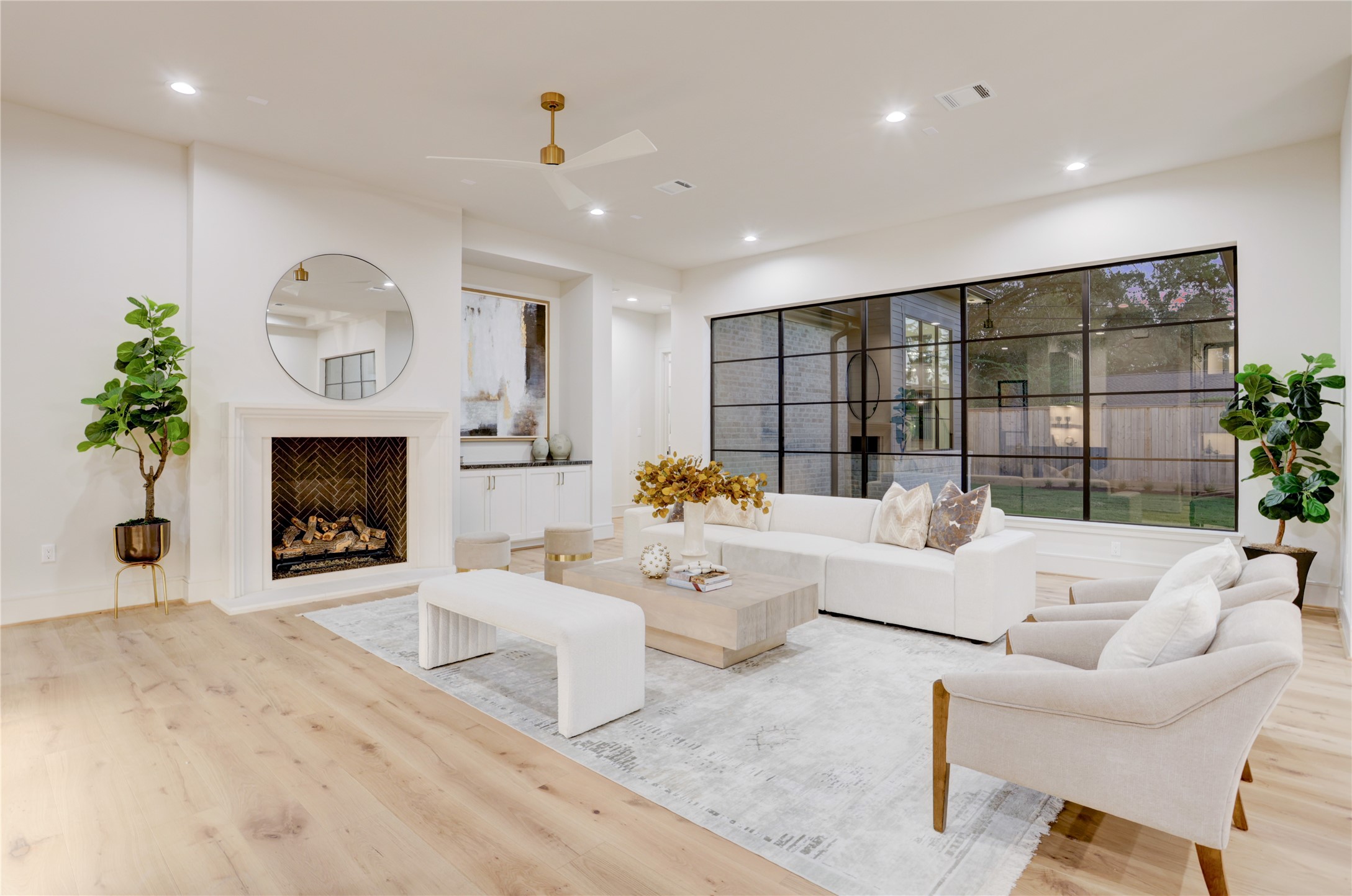 8935 Pado Street Houston, TX 77055 - Photo 12 of 50 a living room with furniture a fireplace and a potted plant