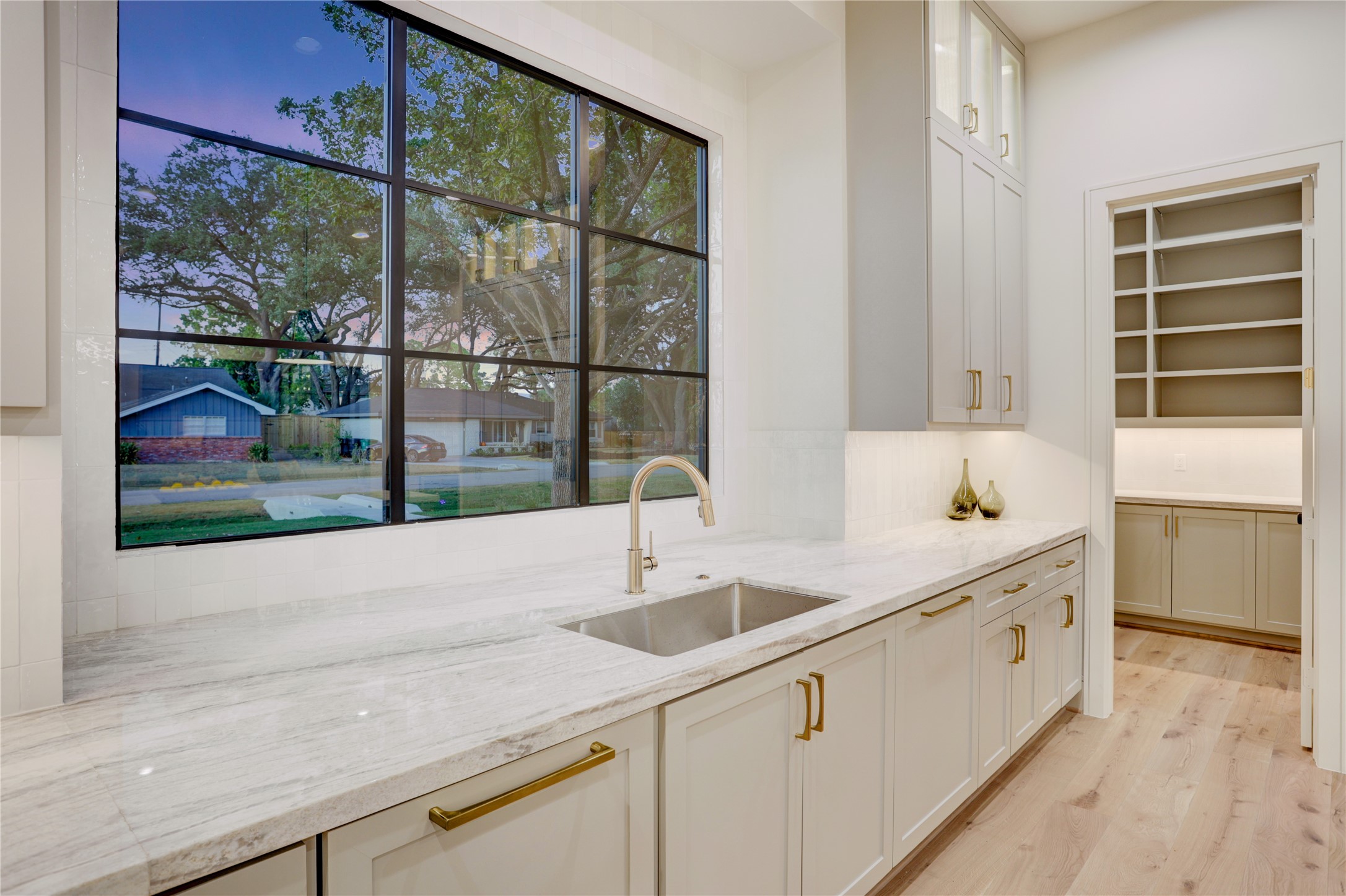 8935 Pado Street Houston, TX 77055 - Photo 19 of 50 a kitchen with a sink and large window