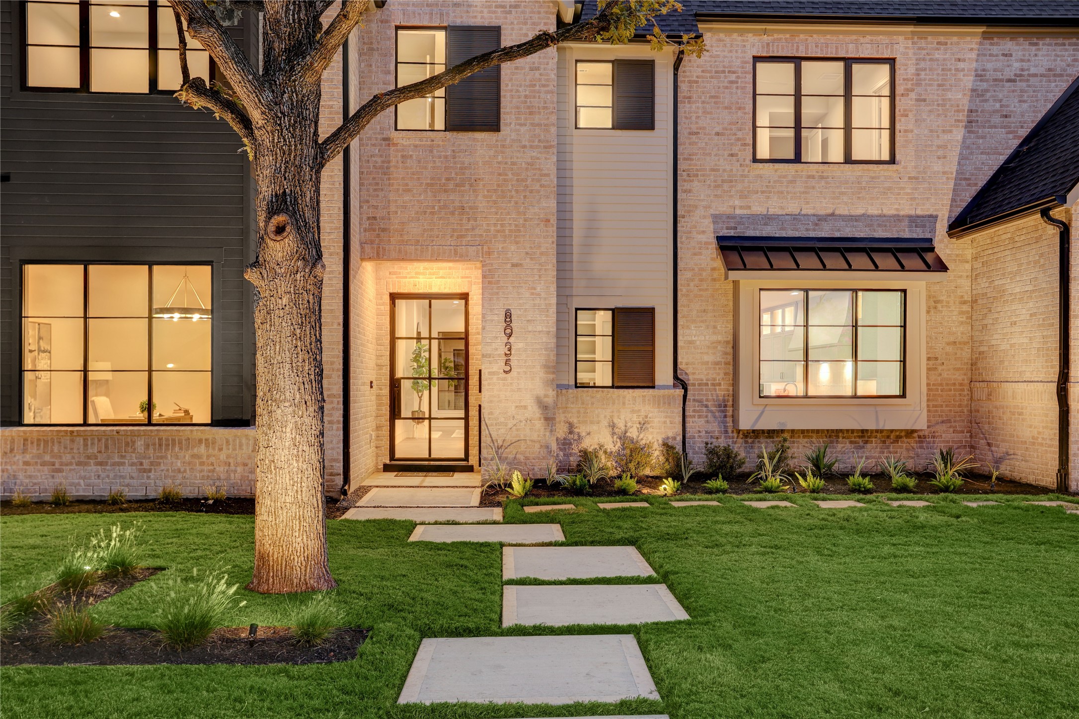 8935 Pado Street Houston, TX 77055 - Photo 2 of 50 a front view of a house with a yard