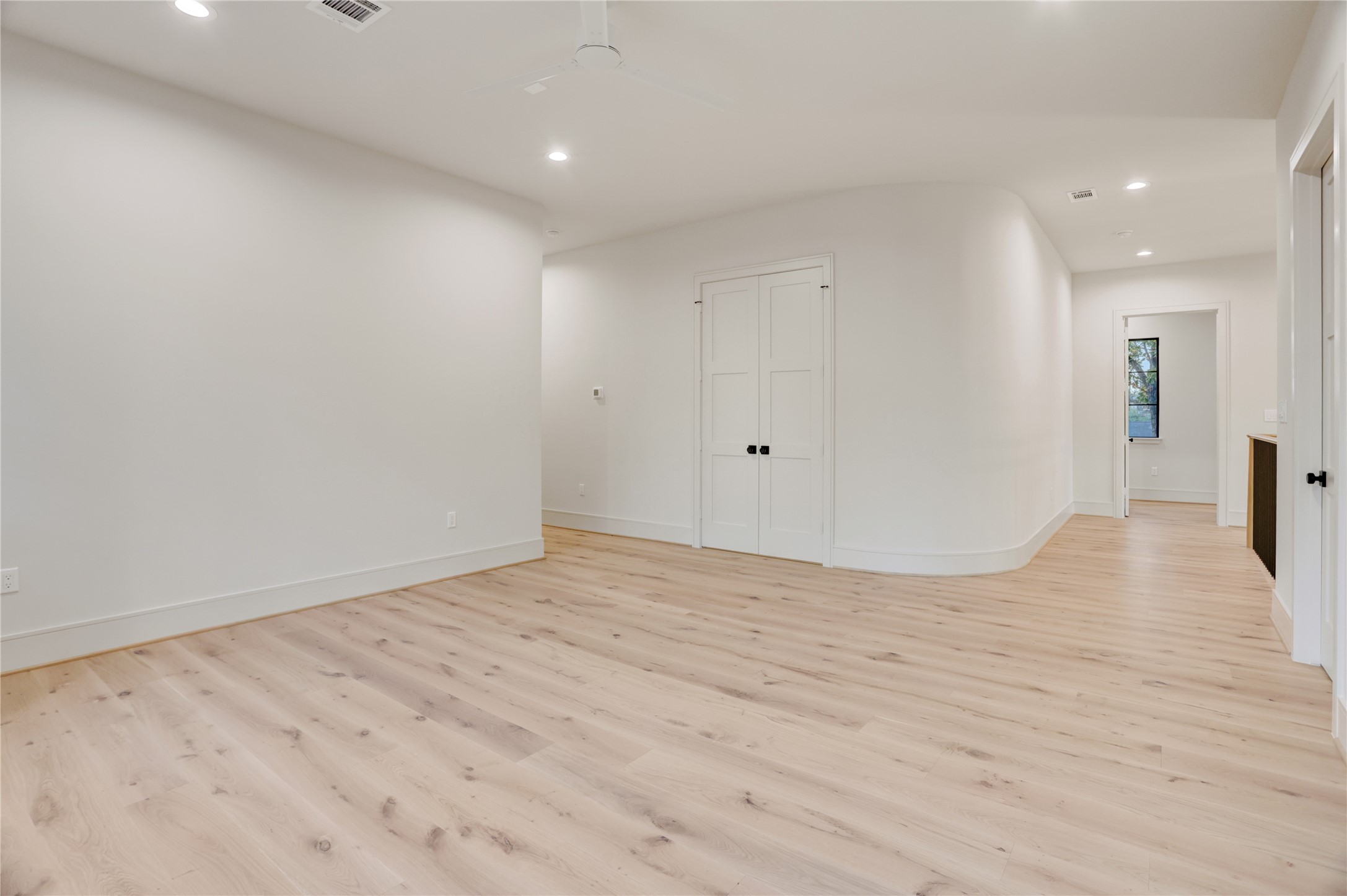 8935 Pado Street Houston, TX 77055 - Photo 33 of 50 a view of empty room with wooden floor
