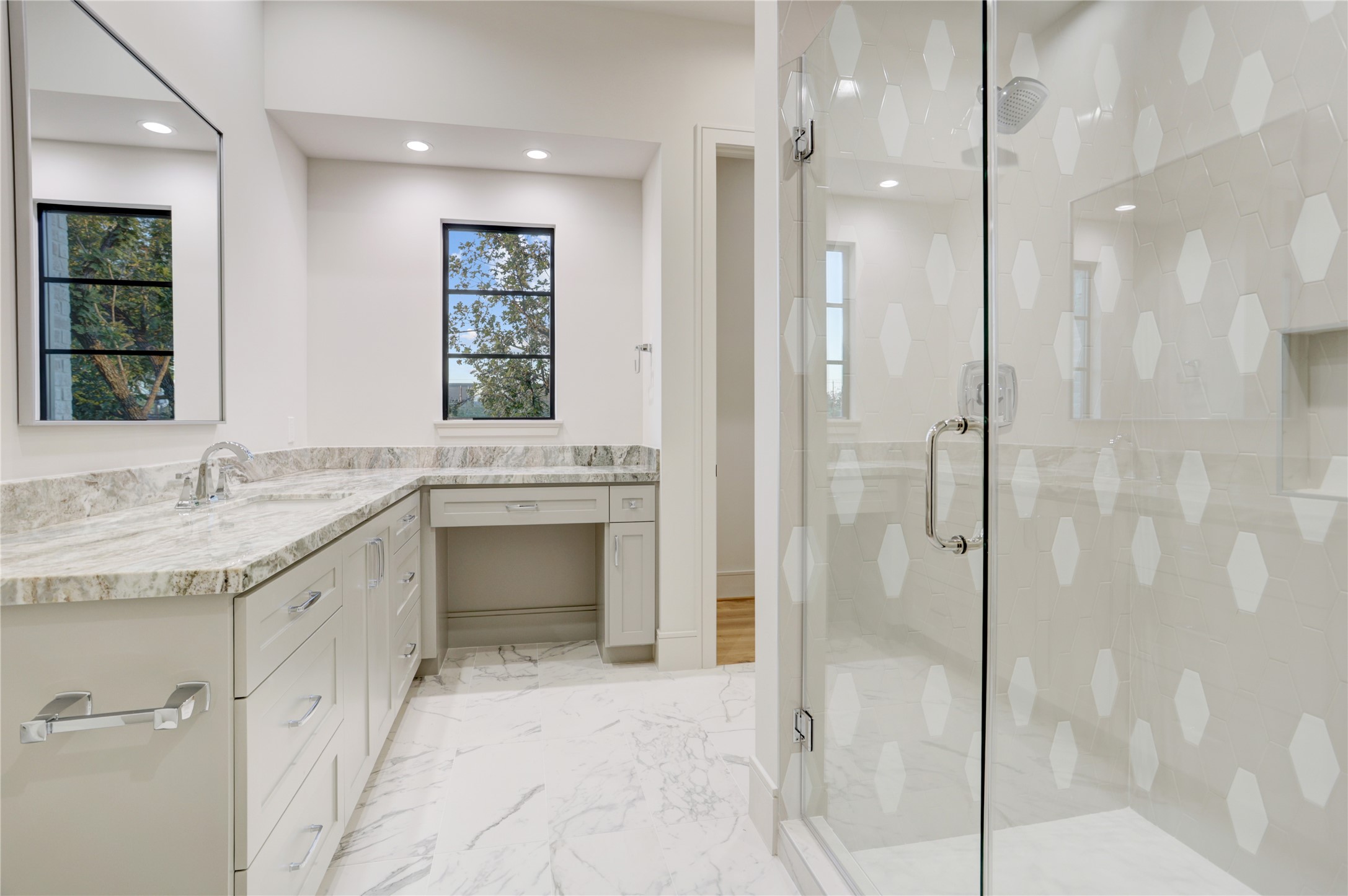 8935 Pado Street Houston, TX 77055 - Photo 38 of 50 a large bathroom with a granite countertop sink mirror and shower