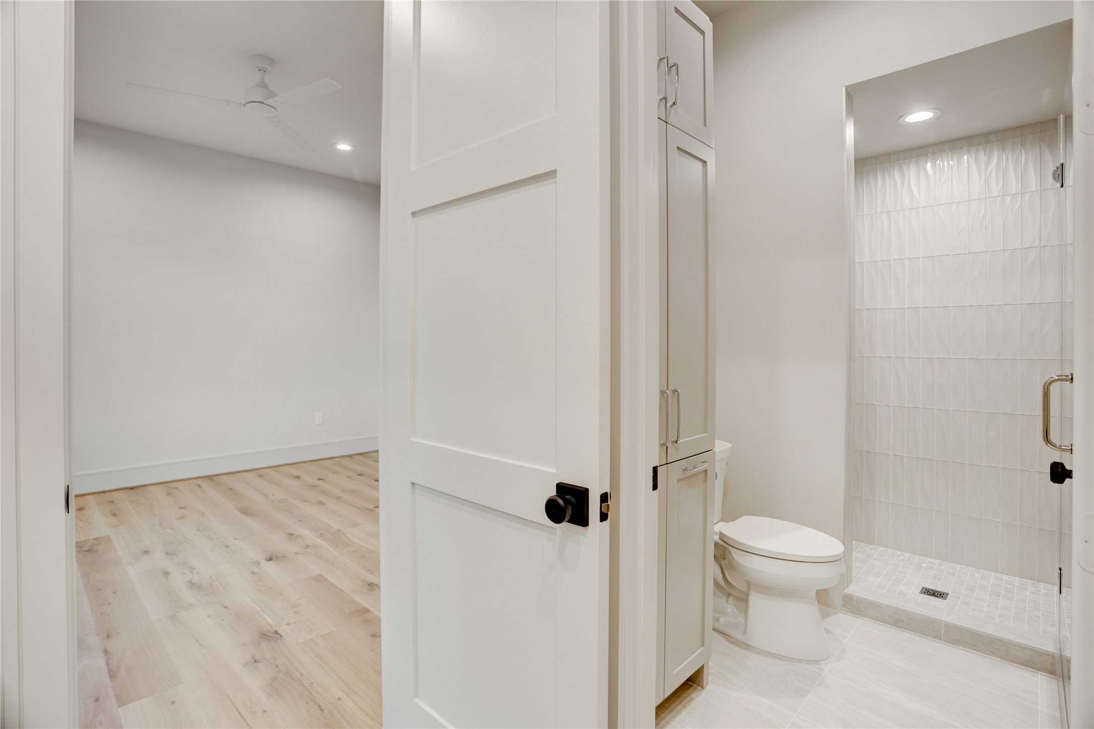 8935 Pado Street Houston, TX 77055 - Photo 45 of 50 a bathroom with a granite countertop toilet a sink and shower