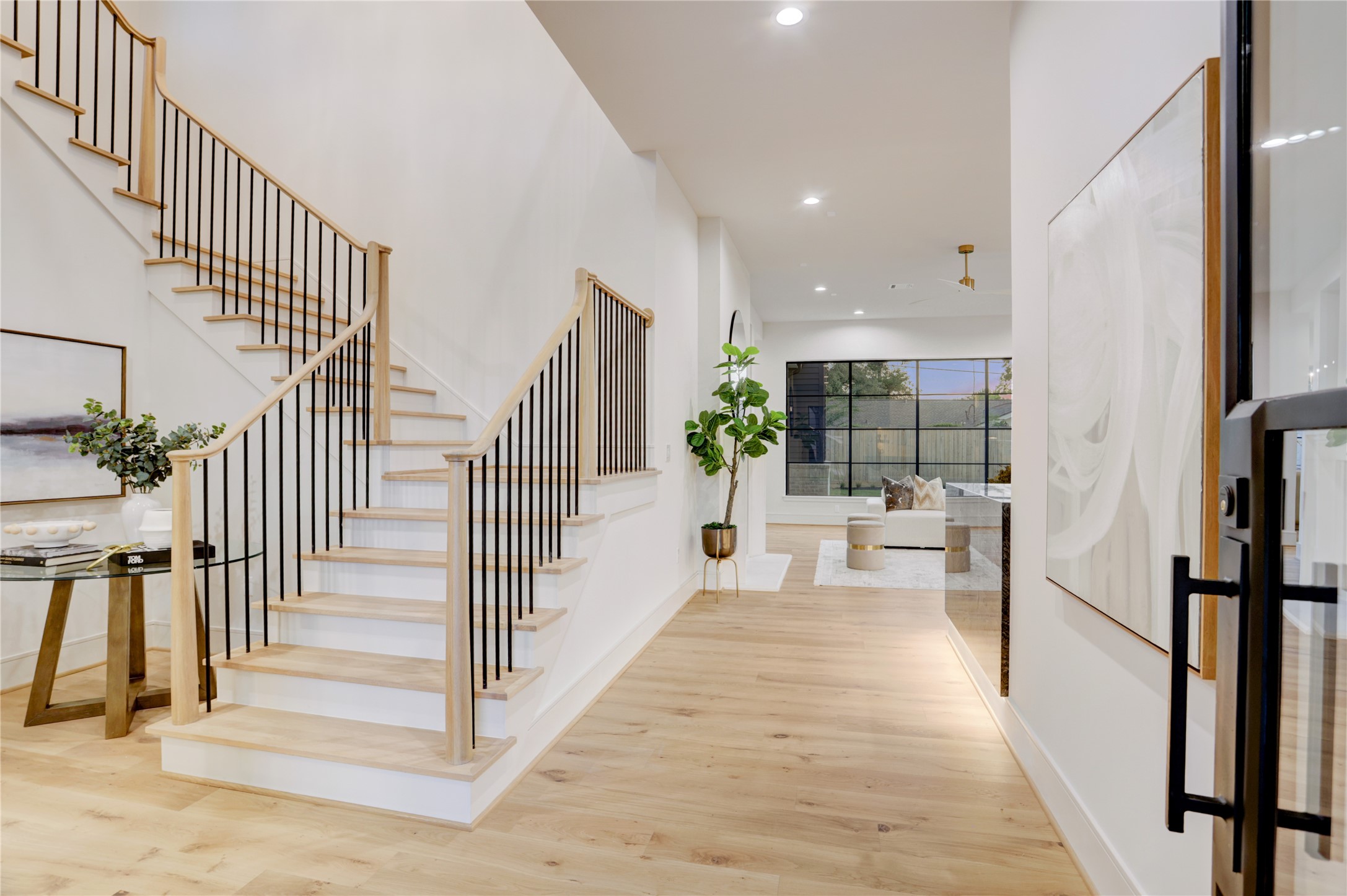 8935 Pado Street Houston, TX 77055 - Photo 7 of 50 a view of entryway and hall with wooden floor