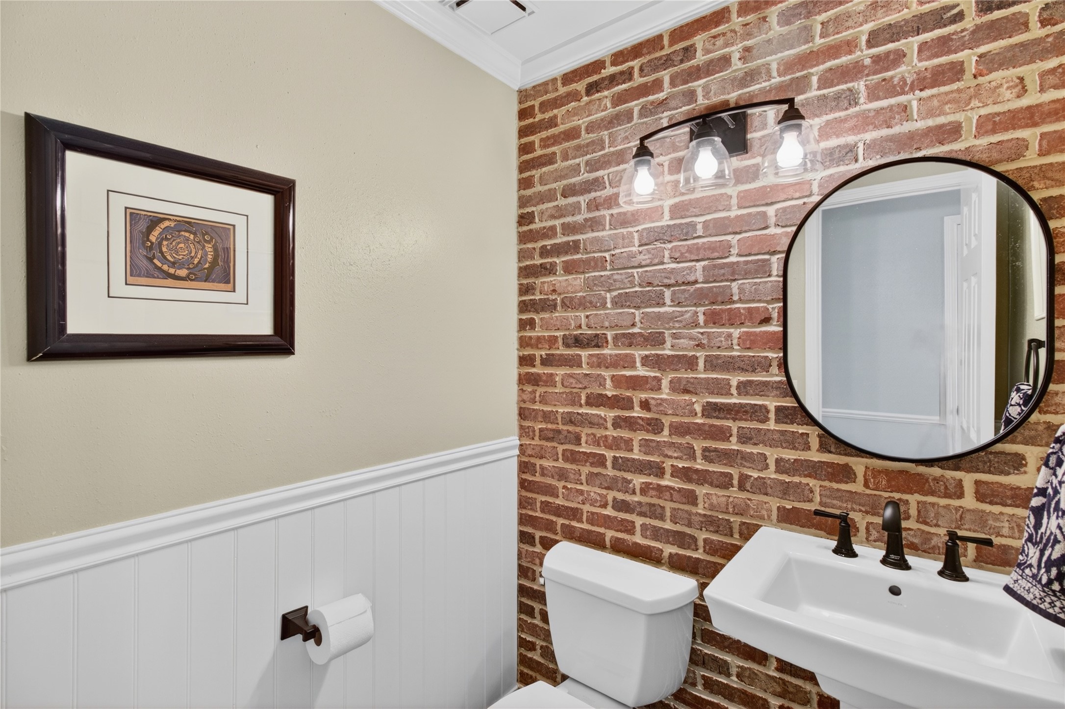 20214 Woodsboro Court Spring, TX 77388 - Photo 24 of 50 Powder Half Bath! Recenlty Updated w/Brick Accent Wall, Lighting, Hardware, Pedestal Sink & Potty! Recently Painted Interior! Luxury Vinyl Plank throughout 1st Floor!