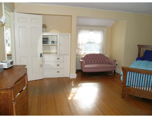 175 Pine Ridge Road Newton, MA 02468 - Photo 14 of 18 a living room with a baby crib furniture and a window