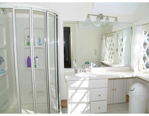 175 Pine Ridge Road Newton, MA 02468 - Photo 15 of 18 a bathroom with a mirror vanity and shower
