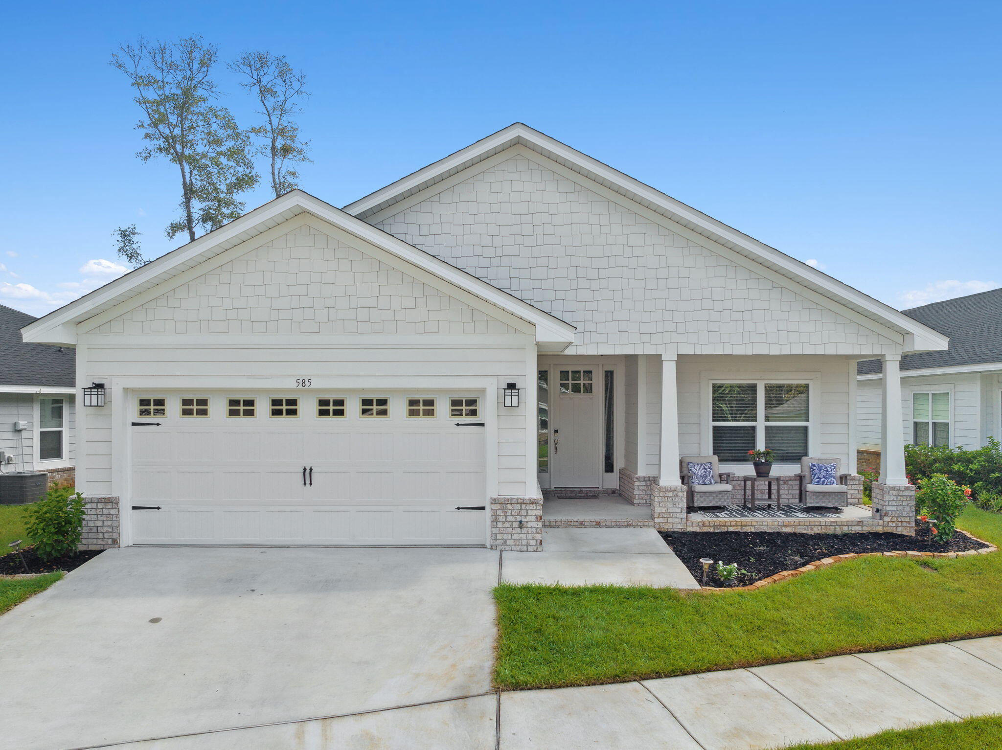 585 Riverwalk Circle Freeport, FL 32439 - Photo 1 of 36 a view of a house with a yard potted plants and a table