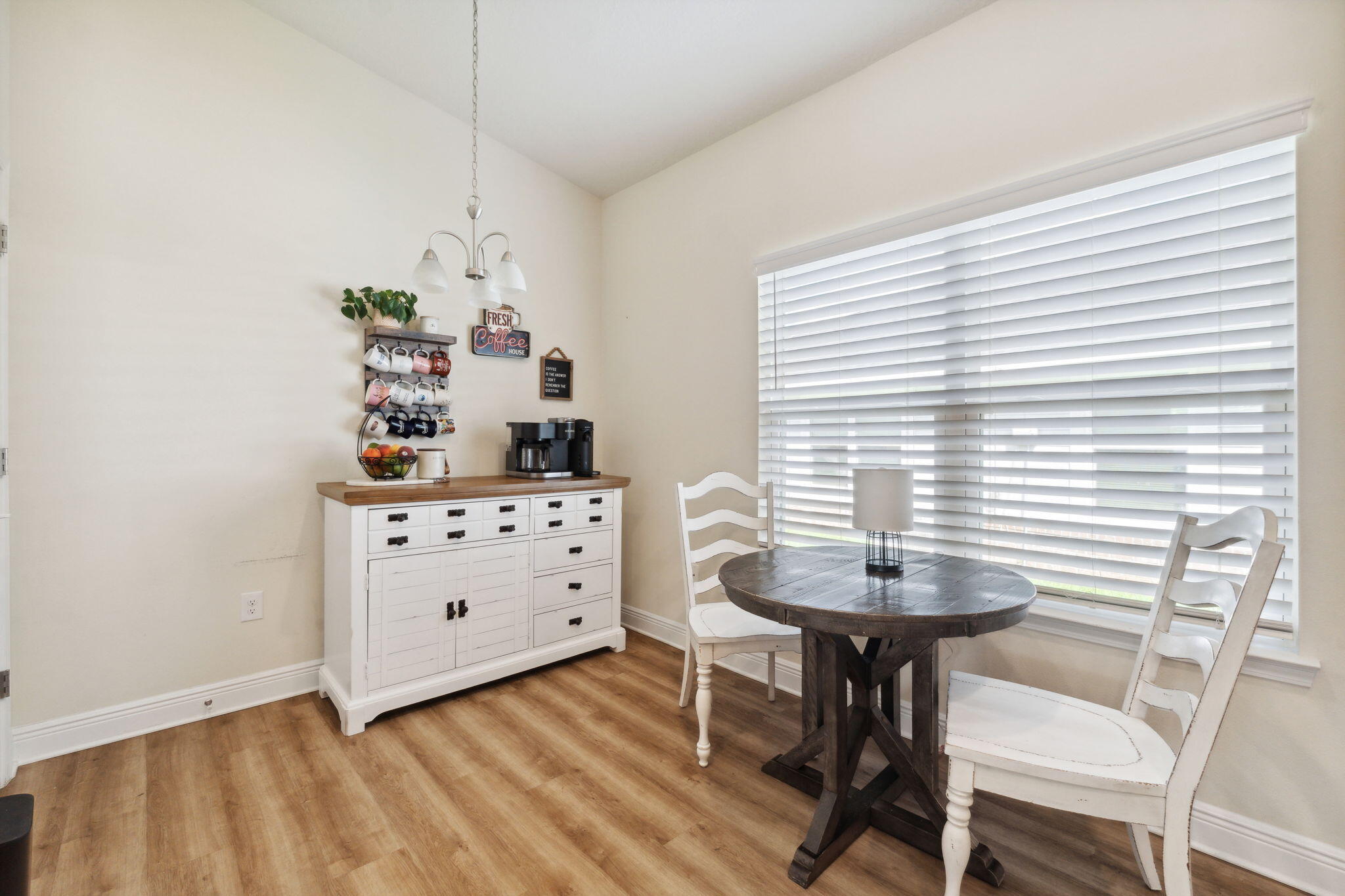 585 Riverwalk Circle Freeport, FL 32439 - Photo 12 of 36 a room with a table and chairs