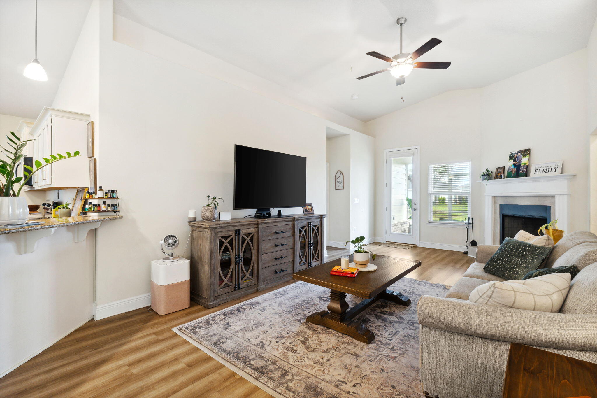 585 Riverwalk Circle Freeport, FL 32439 - Photo 20 of 36 a living room with furniture and a flat screen tv
