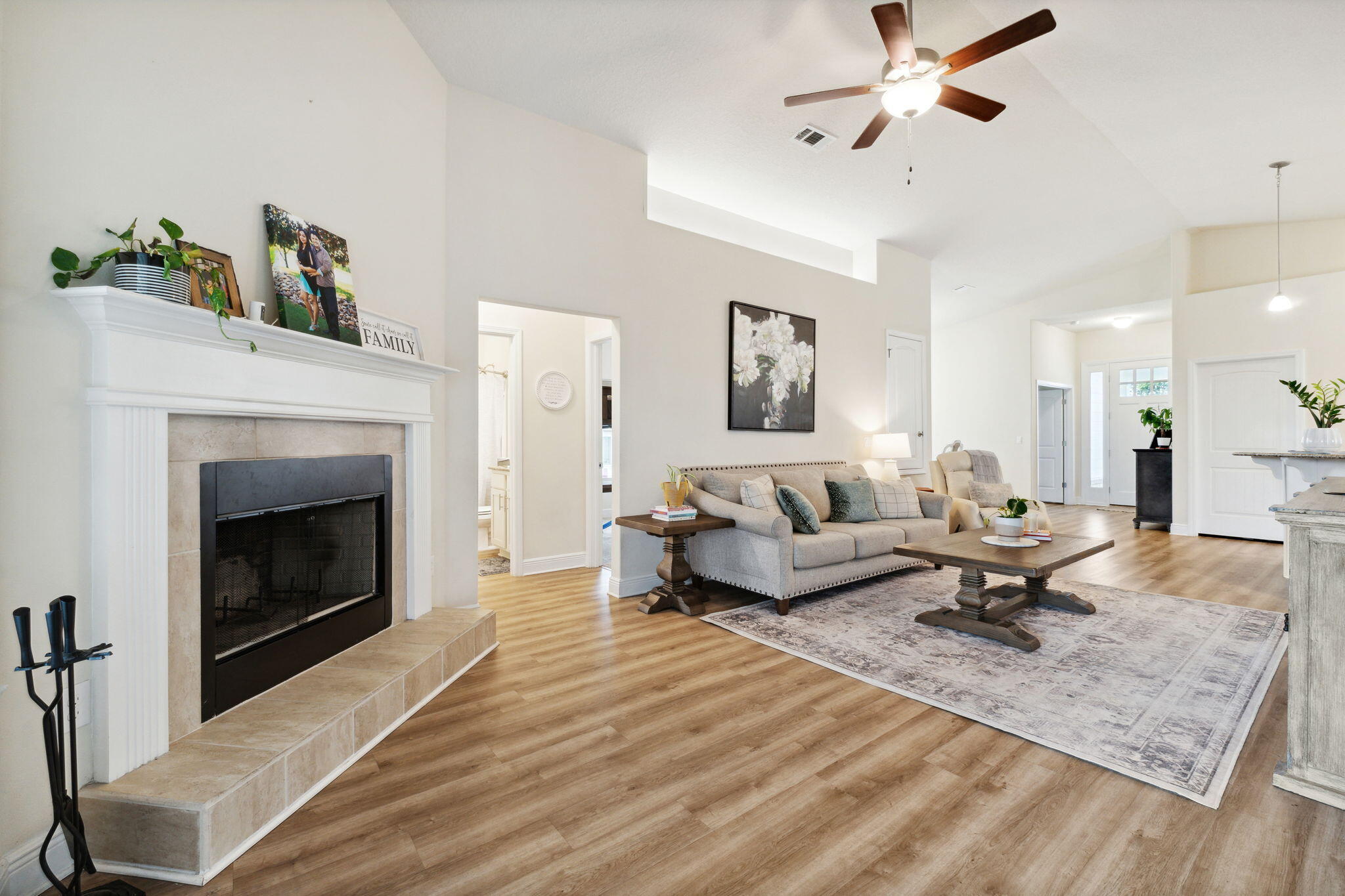 585 Riverwalk Circle Freeport, FL 32439 - Photo 22 of 36 a living room with furniture and a fireplace