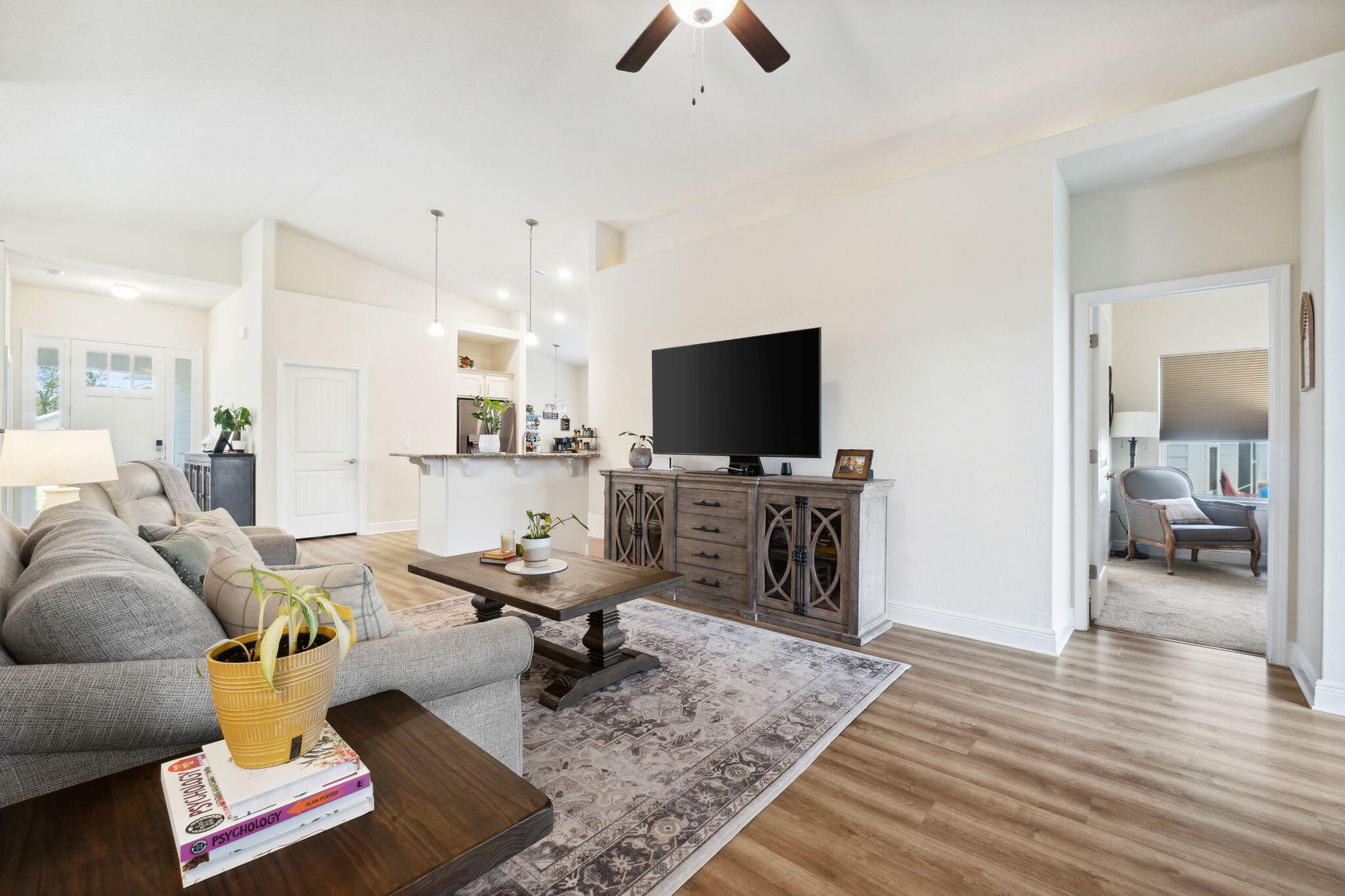 585 Riverwalk Circle Freeport, FL 32439 - Photo 23 of 36 a living room with furniture and a flat screen tv
