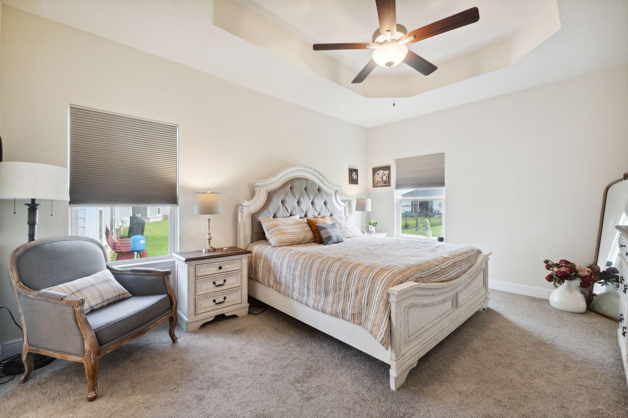 585 Riverwalk Circle Freeport, FL 32439 - Photo 24 of 36 a bedroom with a bed chair and a ceiling fan