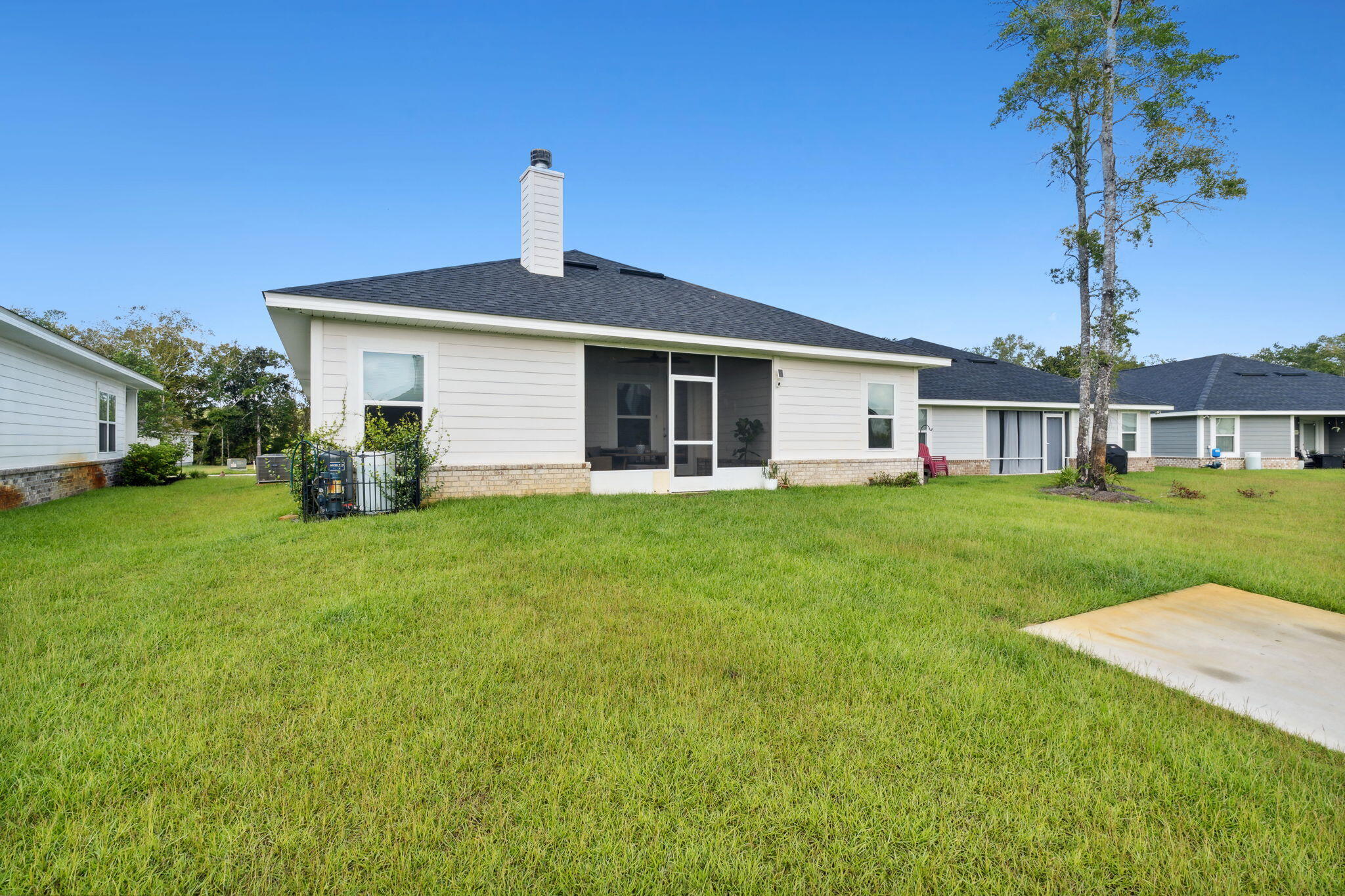 585 Riverwalk Circle Freeport, FL 32439 - Photo 30 of 36 a front view of house with a garden