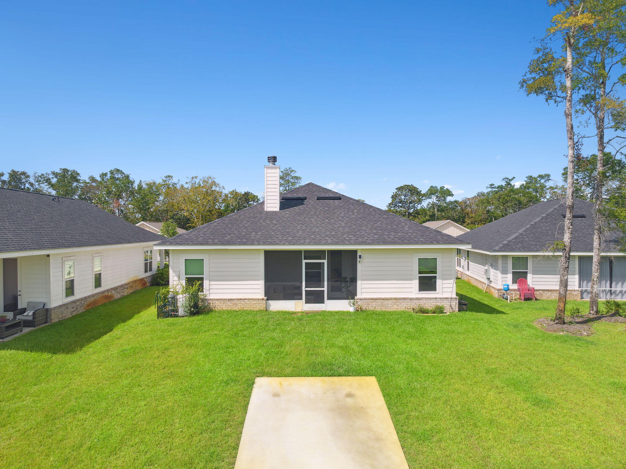 585 Riverwalk Circle Freeport, FL 32439 - Photo 31 of 36 front view of a house with a yard