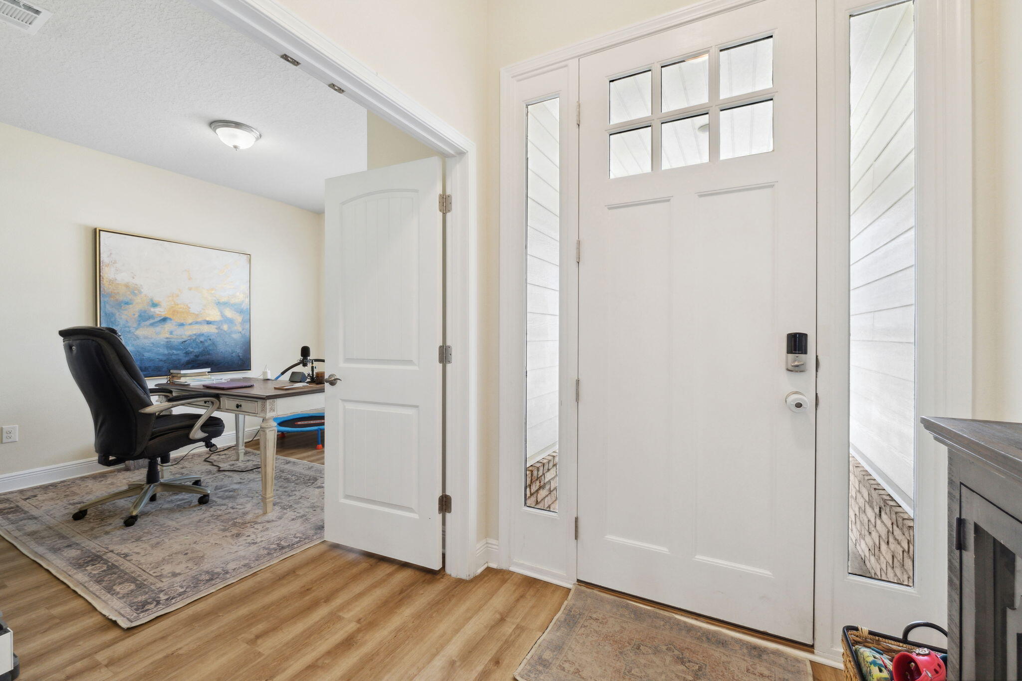 585 Riverwalk Circle Freeport, FL 32439 - Photo 5 of 36 a view of a workspace with furniture and a window