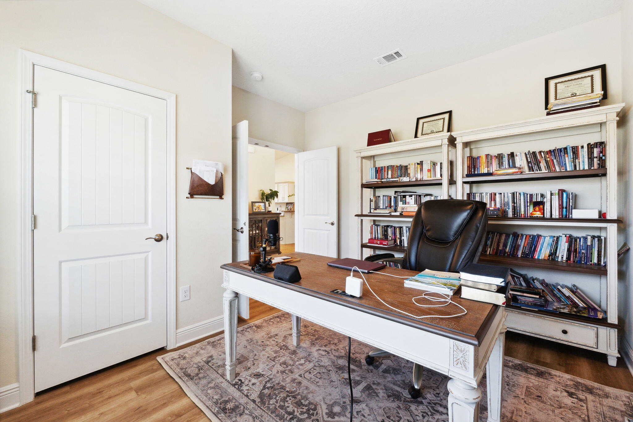 585 Riverwalk Circle Freeport, FL 32439 - Photo 7 of 36 a view of a workspace with furniture and wooden floor