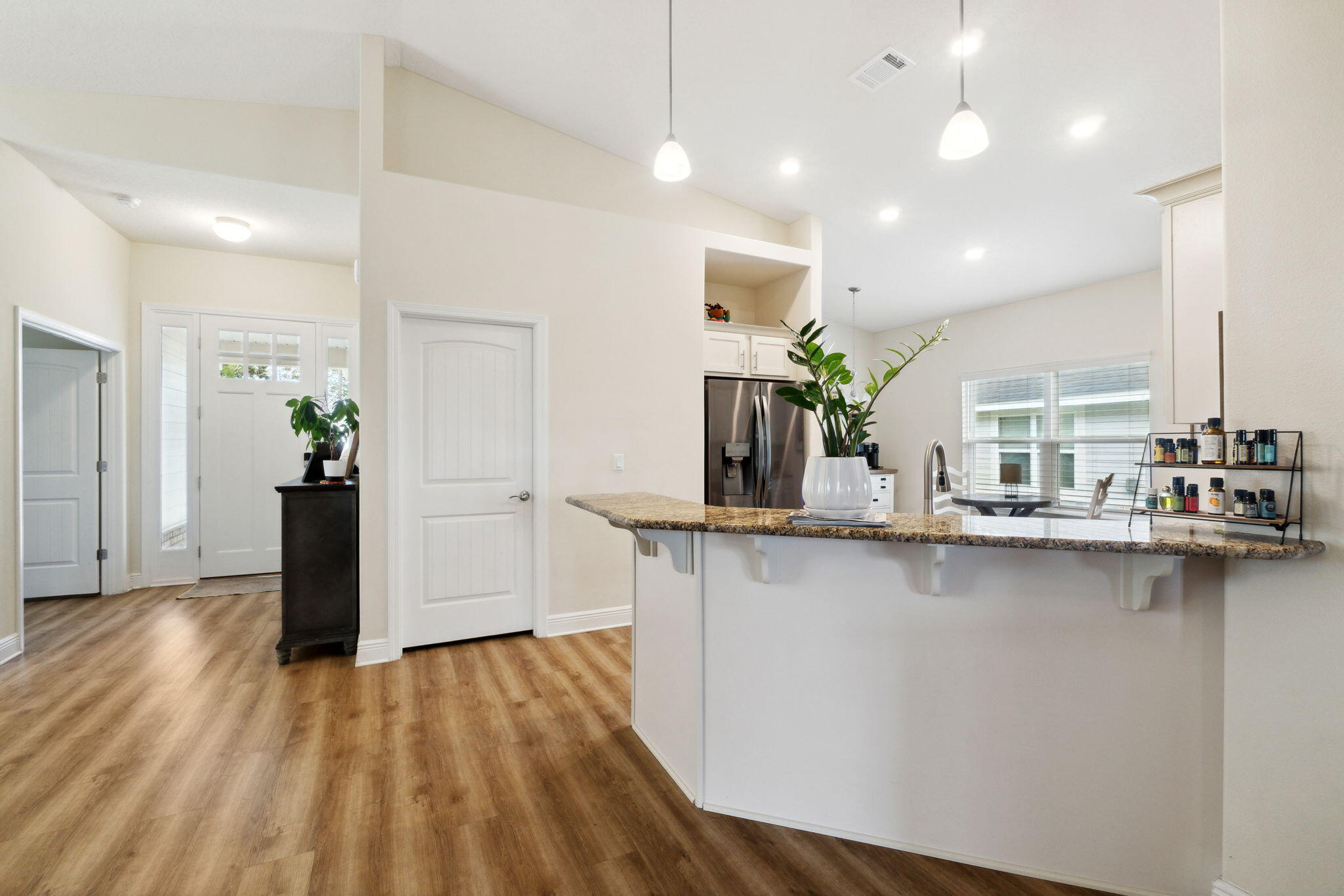 585 Riverwalk Circle Freeport, FL 32439 - Photo 9 of 36 a kitchen with counter top space and wooden floor
