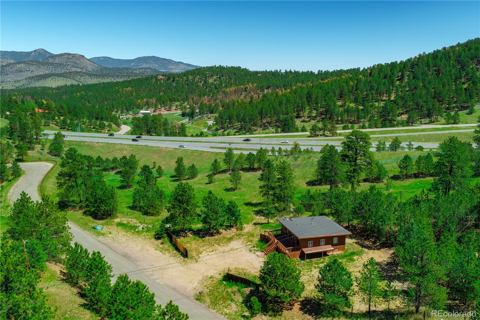 29793 Ruby Ranch Road Evergreen, CO 80439 - Photo 15 of 28 a view of a garden with a lake view