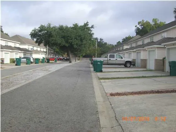 a front view of a house with garage